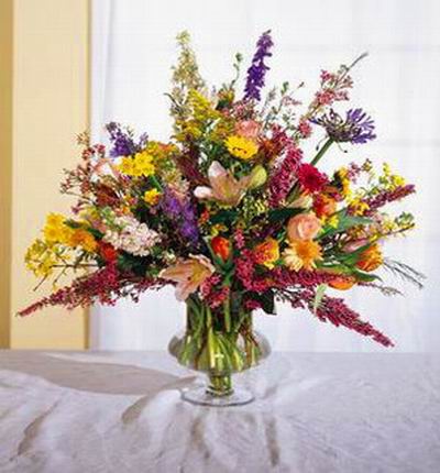 Yellow Sunflowers, yellow Chrysanthemum,pink Roses,pink Lilies, orange Tulips and Stock mix display