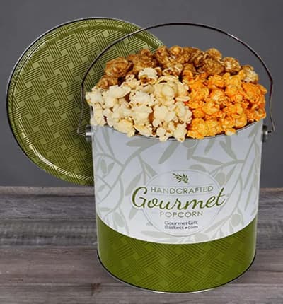 Sweet and salty, crunchy and delicious, who can resist the tempting flavors of cheesy cheddar, rich butter, and smooth caramel popcorn? Your lucky recipient will be delighted to see this tin full of tasty treasures waiting at their door! Our Gourmet Butter Popcorn Tin is the perfect birthday, Christmas, or congratulations gift.

Includes:
* 1 Gallon Popcorn Variety
* Butter
* Cheesy Cheddar
* Caramel