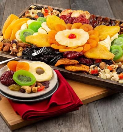 It's never a good idea to show up empty handed, and this eye-catching Fruit and Nut Party Platter is the perfect accompaniment for any occasion! Classic dried fruits like dates and cherries are paired with unique kiwi, apple rings, peaches, mango slices, and more. To top it all off, the corners contain crunchy delicious trail mix and roasted nuts.

Includes:
* Dried Apple Rings
* California Angelino Plums
* California Peaches
* California Prunes
* Glac Cherry
* Dried Kiwi Slices
* Dried Mango Slices
* Pineapple Rings
* Sun-Dried California Dates
* Fruit & Nut Medley
* Natural Trail Mix
* Certified Kosher
* 14