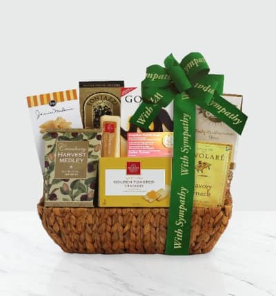 Remember a loved one and comfort those who care when you send this gift basked filled with well wishes. The basket is filled with Beth's chocolate chip cookies, chocolate truffle cookies and Biscotti cookies, Nunes Farms pistachios, Cary's toffee, cheese, crackers, chocolate noirs, Fontazzi butter toffee pretzels, cranberry harvest medley, almond roca and Sonoma cheese straws. This gift also includes a keepsake guardian angel pocket pendant.