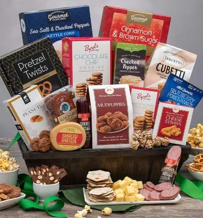 This seemingly endless snack basket is guaranteed to please a crowd, or satisfy your loved one through a time of need. This unique lattice basket is packed to the brim with delightful snacks such as cheese straws, kettle corn and nougat. The treats wouldn't be complete without savory smoked goudah, gourmet sausage and artisan crackers for them to just keep snackin' on!

Includes:
* Cinnamon & Brown Sugar Kettle Corn - 4.2 oz.
* Sea Salt & Cracked Pepper Kettle Corn - 4 oz.
* Chocolate Chip Cookies - 4 oz.
* Chocolate Cubetti Wafer Cookies - 8.8 oz.
* Classic Mini Pretzel Twists - 3 oz.
* Roasted & Salted Peanuts - 2 oz.
* Mudpuppies - 5.5 oz.
* Sea Salt & Cracked Peppercorn Water Crackers - 4 oz.
* Blueberry Pomegranate Trail Mix Crunch - 1 oz.
* Peanut Butter Chocolate Chip Cookies - 2 oz.
* Traditional Cheese Cheese Straws - 1 oz.
* Summer Sausage - 5 oz.
* Almondina Choconut Biscuits - 4 oz.
* Smoked Gouda - 4 oz.