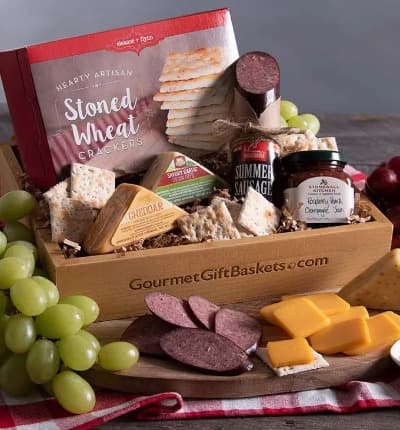 Our decadent spread of sausage, cheese, crackers and jam is perfect for a summer picnic, cozy winter night indoors, or just about any time! This elegant gift can be paired with your favorite fruit and wine, it also has everything you need to enjoy all on its own!

Includes:
* Stoned Wheat Crackers - 4 oz.
* Summer Sausage - 5 oz.
* Savory Garlic Cheddar Cheese - 2 oz.
* Spicy Cheddar & Veggie Cheese - 2 oz.
* Raspberry Peach Champagne Jam - 4 oz.