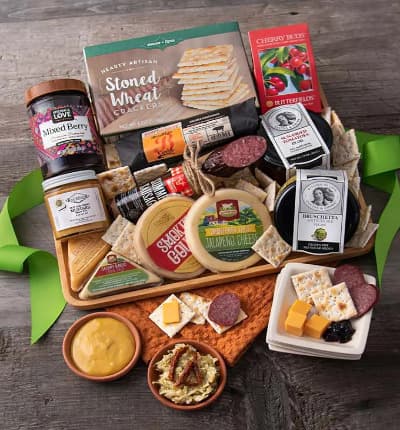 This artisan meat and cheese platter features all sorts of bright, savory, sweet, and bold flavors. Our extravagant basket includes everything from Monterey jack jalapeno cheese, to artichoke bruschetta, delightful summer sausage, sweet cherry candies and so much more!

Includes:
* Savory Garlic Cheddar Cheese - 2 oz.
* Cheddar Cheese - 2 oz.
* Monterey Jack Jalapeno Cheese - 4 oz.
* Ultra Sharp Cheddar Cheese - 4 oz.
* Mixed Berry Preserves - 12.3 oz.
* Stoned Wheat Crackers - 4 oz.
* Sun Dried Tomatoes - 7.9 oz.
* Artichoke Bruschetta - 7.9 oz.
* Hot and Sweet Mustard - 4 oz.
* Summer Sausage - 5 oz.
* Smoked Pepperoni - 6 oz.
* Cherry Buds Hard Candies - 1.75 oz.