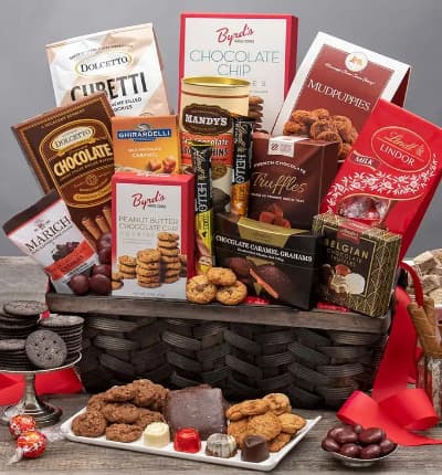 This grand gourmet basket is every chocolate lovers dream come true! We've compiled our most beloved chocolate delicacies and essentials to make this luxury gift basket. The lucky recipient won't be able to resist chocolate caramel grahams, red velvet cookies, mudpuppies, french chocolate truffles, and oh so much more!

Includes:
* Chocolate Chip Cookies - 4 oz.
* Mudpuppies - 5.5 oz.
* Milk Chocolate Truffle Gift Bag - 5.1 oz.
* Peanut Butter Chocolate Chip Cookies - 2 oz.
* Chocolate Covered Cherries - 2.3 oz.
* French Chocolate Truffles - 3.5 oz.
* Salted Caramel Bar - 1.4 oz.
* Cookies & Cream Bar - 1.4 oz.
* Chocolate Caramel Grahams - 2.6 oz.
* Belgian Chocolates - 1.76 oz.
* Dark Chocolate Cookie Thins - 4.6 oz.
* Caramel filled Milk Chocolate Bar - 3.5 oz.
* Cubetti Wafer Cookie Bag - Chocolate - 8.8 oz.
* Dolcetto Chocolate Wafer Rolls - 4.4 oz.