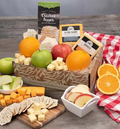 We've put together the perfect, thoughtful, pick-me-up basket. Universally beloved fresh fruit, smoky sausage, sharp cheddar cheese, with salt & pepper water crackers, can be enjoyed in blissful snacking harmony. No matter who you're shopping for, they're sure to love this wholesome, decadent, box of natural abundance.

Includes:
* Oranges - 2 ct.
* Apples - 2 ct.
* Sea Salt & Cracked Peppercorn Water Crackers - 4 oz.
* Cheddar Cheese - 6 oz.
* Smoked Gouda Cheese - 6 oz.