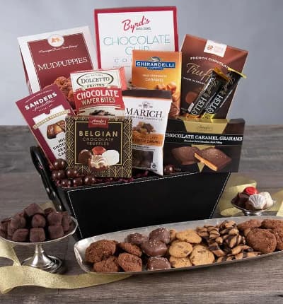 Chocolate goodies in wonderous abundance will greet your lucky friend, client, or sweetheart when you send them the Chocolate Decadence Gift Basket. Available for next day delivery, this posh assortment of truffles, chocolates, cookies, caramels, wafers and other sweets will bring a beaming smile to their face!

Includes:
* Chocolate Chip Cookies - 4 oz.
* Mudpuppies - 5.5 oz.
* French Chocolate Truffles - 3.5 oz.
* Dark Chocolate & Sea Salt Caramel Filled Bar - 3.5 oz.
* Belgian Chocolates - 1.76 oz.
* Chocolate Wafer Petites - .7 oz.
* Milk Chocolate Sea Salt Caramels - 1 oz.
* Chocolate Caramel Grahams - 2.6 oz.
* Salted Caramel Bar - 1.4 oz.
* Cookies & Cream Bar - 1.4 oz.
* English Toffee Caramels - 2.1 oz.