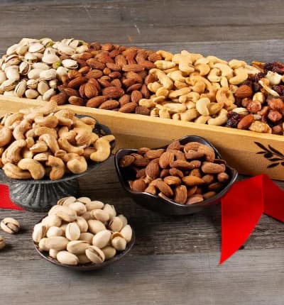 A gourmet assortment of delicious and healthy roasted salted pistachios, cashews and almonds are paired with trail mix in an elegant wooden tray making a thoughtful gift, appropriate for any occasion. Send your love, condolences, congratulations or thanks in a cute and tasty package!

Includes:
* Roasted Salted Pistachios - 6 oz.
* Roasted Salted Cashews - 7 oz.
* Roasted Salted Almonds - 6 oz.
* Trail Mix - 4 oz.
* Wooden Tray