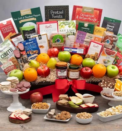 Our most extravagant gift basket yet, the Ultimate Fruit and Gourmet Gift is perfect for all gatherings, formal or informal. From family get togethers to corporate events, this spread is a thoughtful, luxurious way to complete the day. Sure to please all tastes, this luxury spread includes everything from cheese and crackers, to cookies and candies, popcorn and nuts, pretzels and trail mix, hard candies, chocolate covered cherries, and so much more!

Includes:
* Hazelnut Cubetti Wafer Cookie Bag - 8.8 oz.
* Almonduo Almondina Biscuits - 4 oz.
* Blood Orange Organic Hard Candies - 3.5 oz.
* Chocolate Covered Cherries - 2.3 oz.
* Almond Cashew Clusters with Pumpkin Seeds - 1 oz.
* Blueberry Pomegranate Trail Mix Crunch - 1 oz.
* Key Lime Cookies - 2.25 oz.
* Cinnamon & Brown Sugar Kettle Corn - 4.2 oz.
* Sea Salt & Cracked Pepper Kettle Corn - 4 oz.
* Classic Mini Pretzel Twists - 3 oz.
* Roasted & Salted Peanuts - 2 oz.
* Chichester Crunch - 2 oz.
* Chocolate Wafer Petites - 0.7 oz.
* Chocolate Chip Cookies - 4 oz.
* Key Lime Cookies - 4 oz.
* Peanut Butter Chocolate Chip Cookies - 2 oz.
* Almond Nougat - 4 oz.
* Cherry Buds Hard Candies - 1.75 oz.
* Garlic Sausage - 5 oz.
* Sea Salt Caramel Sauce - 12.25 oz.
* Summer Sausage - 5 oz.
* Choconut Almondina Biscuits - 4 oz.
* Oatcake Biscuits - 7.2 oz.
* Cheese Straws - 4 oz.
* 4 Red Apples
* 4 Green Apples
* 4 Oranges
* 3 Pears
* Assorted Citrus Slices - 5pc
* Keepsake Gift Basket