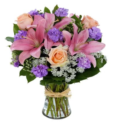 * Pink Asiatic Lilies
* Purple Mini Carnations
* Peach Roses
* Queen Anne's Lace
* Clear Gathering Vase with Raffia