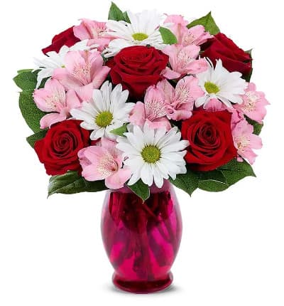 * Red Roses
* Pink Alstroemeria
* White Daisies
* Seasonal Greens
* Pink Fluted Vase