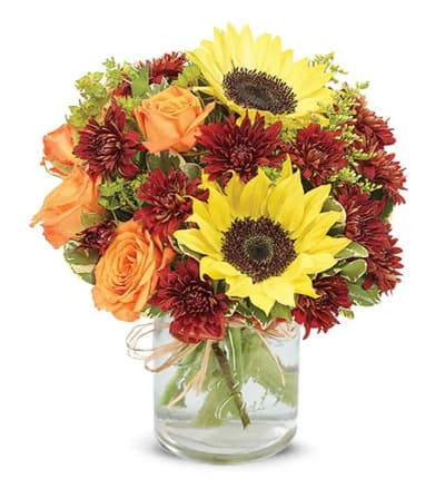 * Sunflowers
* Orange Spray Roses
* Bronze Cushion Poms
* Red Hypericum
* Bupleurum
* Solidago
* Pittosporum
* Clear Glass