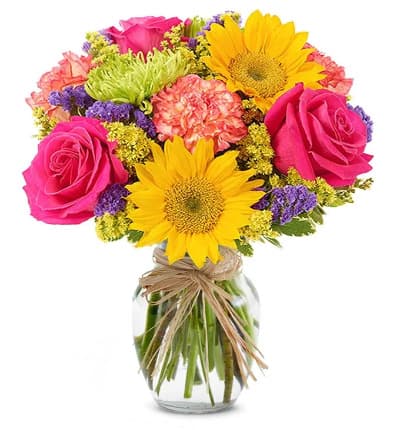 * Hot Pink Roses
* Sunflowers
* Green Figi Mums
* Orange Carnations
* Solidago
* Purple Statice
* Pittosporum
* Natural Raffia
* Clear Glass Vase