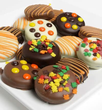 OREO® Cookies are a fantastic treat any day. They are even better when they are dipped in Belgian chocolate and decorated with delicious fall treats. Everything you love about OREOS® will make this gift so sweet for that special someone.
Includes:
* 12 Chocolate Dipped OREO Cookies
* White, Dark and Milk Chocolate
* Topped with Fall Candies.
ALLERGEN ALERT: Product contains egg, milk, soy, wheat, peanuts, tree nuts and coconut. We recommend that those with food related allergies take the necessary precautions.
