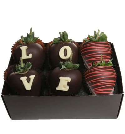 Chocolate Covered Strawberries are the quintessential gourmet Valentine's Day gift and these are the ULTIMATE Chocolate Covered Strawberries. Six fresh and juicy strawberries are hand dipped in Belgian Chocolate and decorated with the letters L-O-V-E making it a beautiful and romantic gift.
Includes:
* Six Strawberries
* Chocolate 'Love' Message
* Dipped in Belgian Chocolate
* Delivered in Gift Box.
ALLERGEN ALERT: Product contains egg, milk, soy, wheat, peanuts, tree nuts and coconut. We recommend that those with food related allergies take the necessary precautions.
