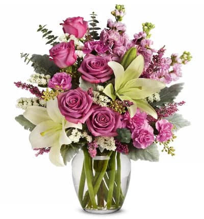 * Lavender Roses
* White Asiatic Lilies
* Mini Pink Carnations
* Pink Stock
* White Sinuata Statice
* Lavender Heather
* Seeded Eucalyptus
* Dusty Miller
* Spiral Eucalyptus
* Glass Vase