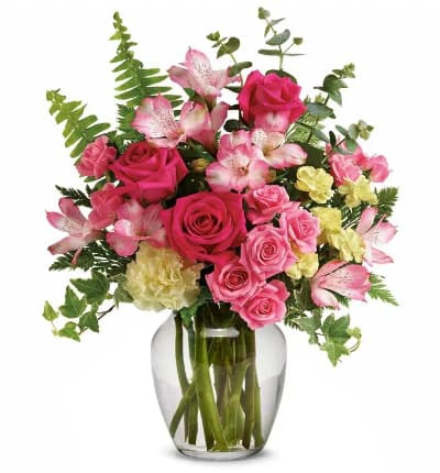 * Hot Pink Roses
* Pink Spray Roses
* Light Yellow Carnations
* Light Yellow Mini Carnations
* Pink Alstroemeria
* Sword Fern
* Spiral Eucalyptus
* Variegated Ivy
* Leatherleaf Fern
* Clear Glass Vase