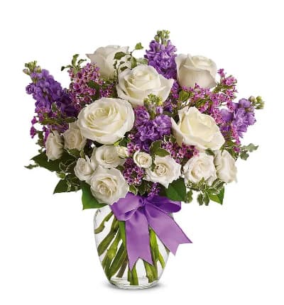 * White Full-Size Roses
* White Spray Roses
* Lavender Stock & Waxflower
* Lavender Satin Ribbon
* Glass Vase