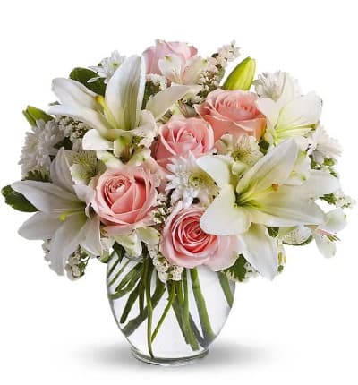 * Pink Roses
* White Asiatic Lilies
* Alstroemeria
* White Cushion Spray Mums
* Glass Vase